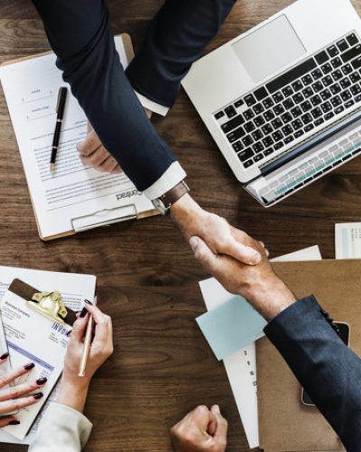 Business people shaking hands together Business people shaking hands together